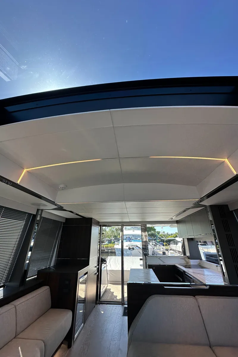 Slide: The Image of Interior of 2023 Sunseeker 65 Sport Yacht with modern design and panoramic views. - 32