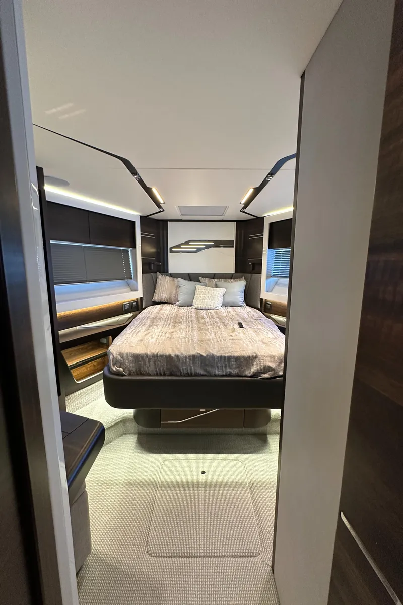 Slide: The Image of 2023 Sunseeker 65 Sport Yacht bedroom interior with modern design and cozy bedding. - 35