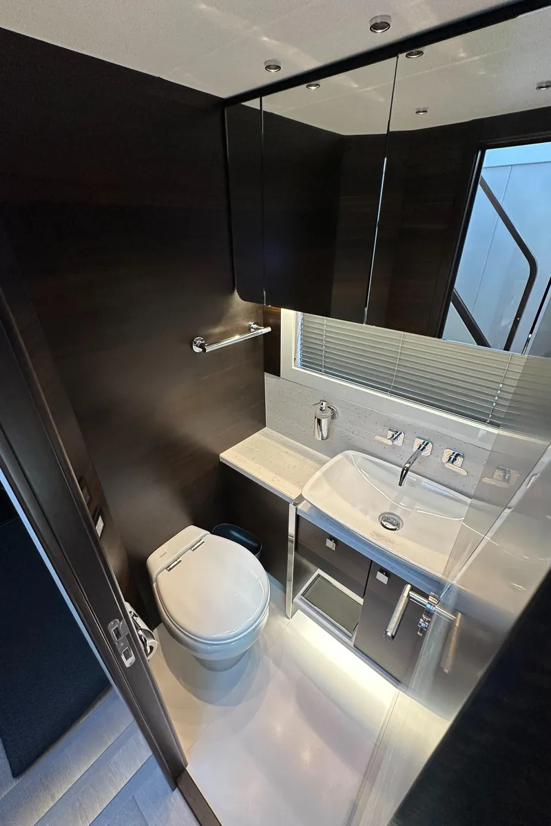 Slide: The Image of 2023 Sunseeker 65 Sport Yacht bathroom with modern fixtures and sleek design. - 39