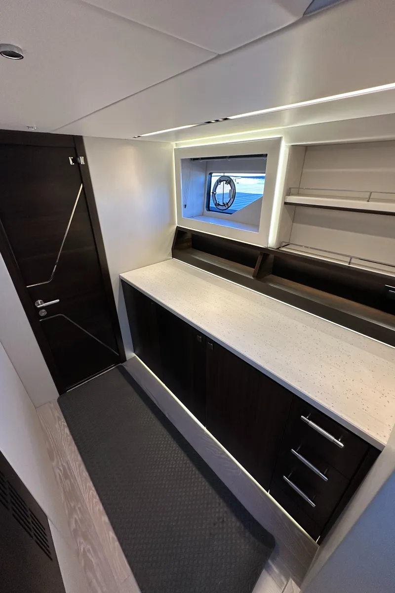 Slide: The Image of Interior of 2023 Sunseeker 65 Sport Yacht with modern cabinetry and sleek design. - 40