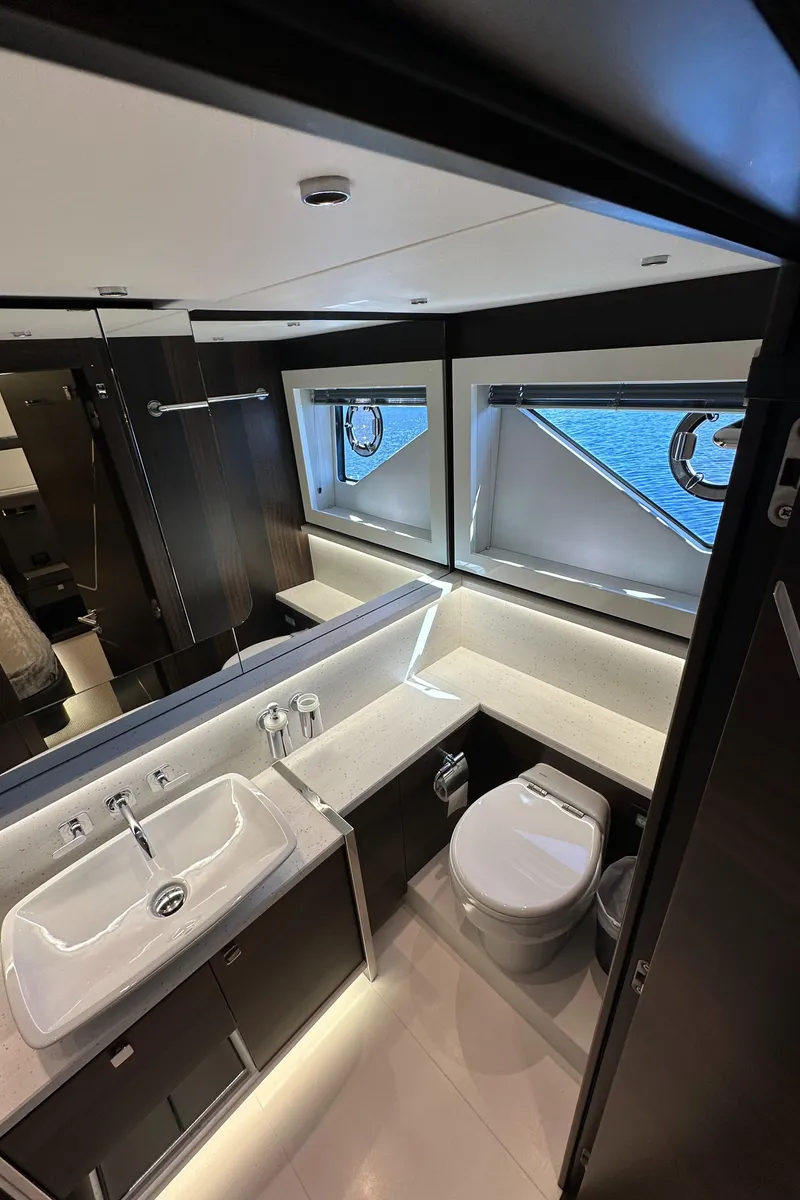 Slide: The Image of Luxurious bathroom in 2023 Sunseeker 65 Sport Yacht with modern fixtures and ocean view. - 41