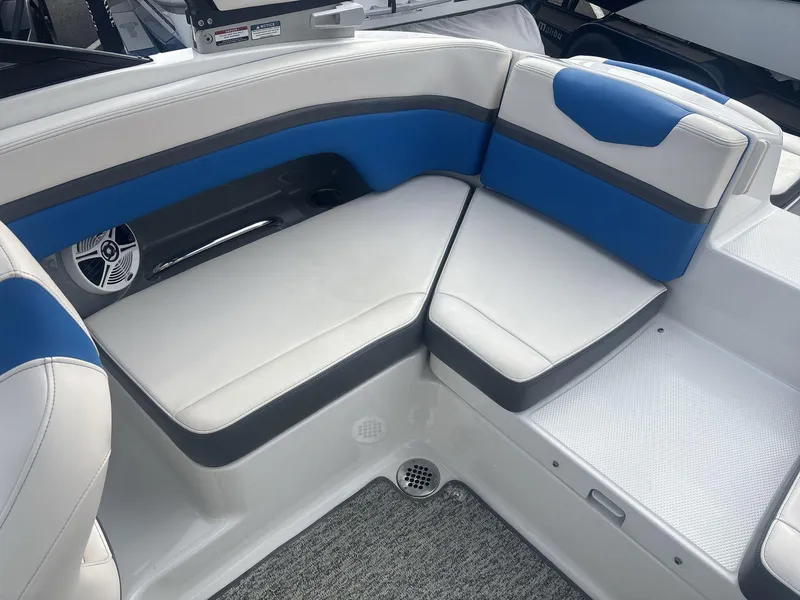 Slide: The Image of Interior seating of 2017 Chaparral 203 Vortex boat with blue and white upholstery. - 11