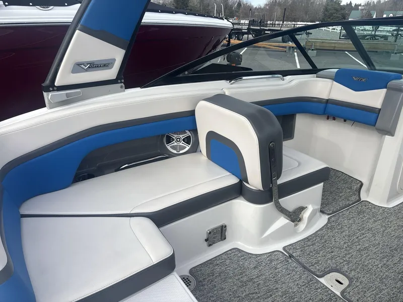 Slide: The Image of 2017 Chaparral 203 Vortex boat interior with blue and white seating. - 12