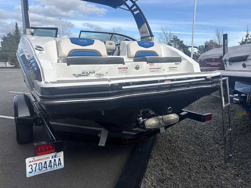 Slide: The Image of 2017 Chaparral 203 Vortex boat on trailer, rear view, parked outdoors. - 4