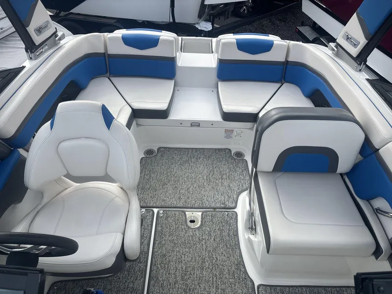 Slide: The Image of 2017 Chaparral 203 Vortex boat interior with blue and white seating. - 7