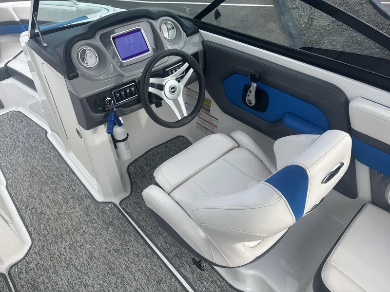 Slide: The Image of 2017 Chaparral 203 Vortex boat interior with steering wheel and dashboard controls. - 8