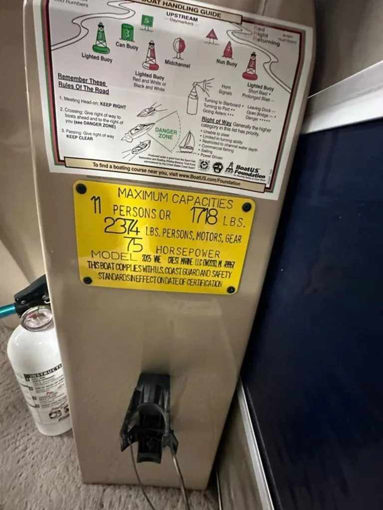 Slide: The Image of Capacity and safety information on a 2013 Crest II 210 Series boat. - 9