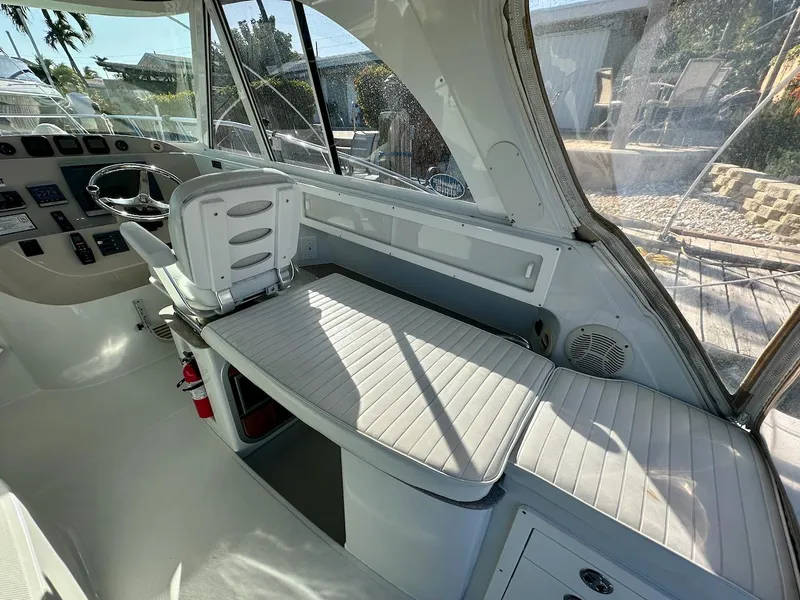 Slide: The Image of 2009 Glacier Bay 3080 boat interior with helm and seating area. - 2