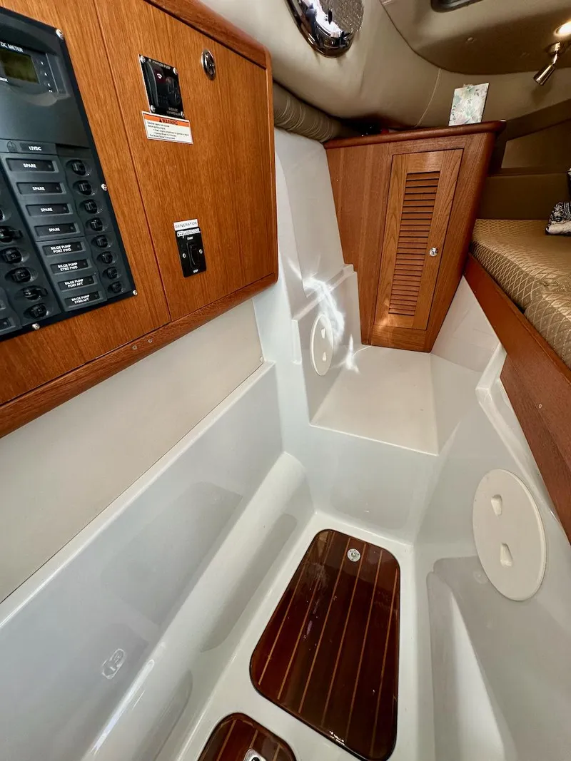Slide: The Image of 2009 Glacier Bay 3080 cabin interior with wood paneling and control panel. - 21
