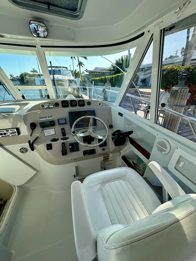 Slide: The Image of Interior view of 2009 Glacier Bay 3080 boat cockpit with steering wheel and controls. - 5