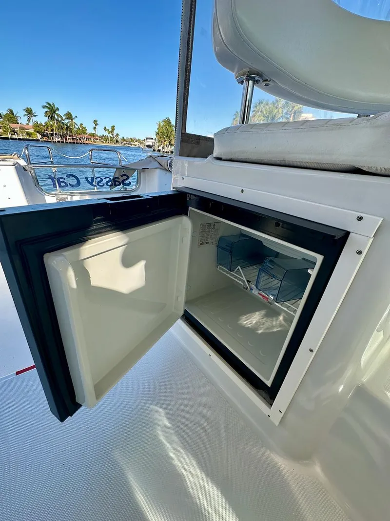 Slide: The Image of Open refrigerator on 2009 Glacier Bay 3080 boat, with scenic waterfront view. - 13