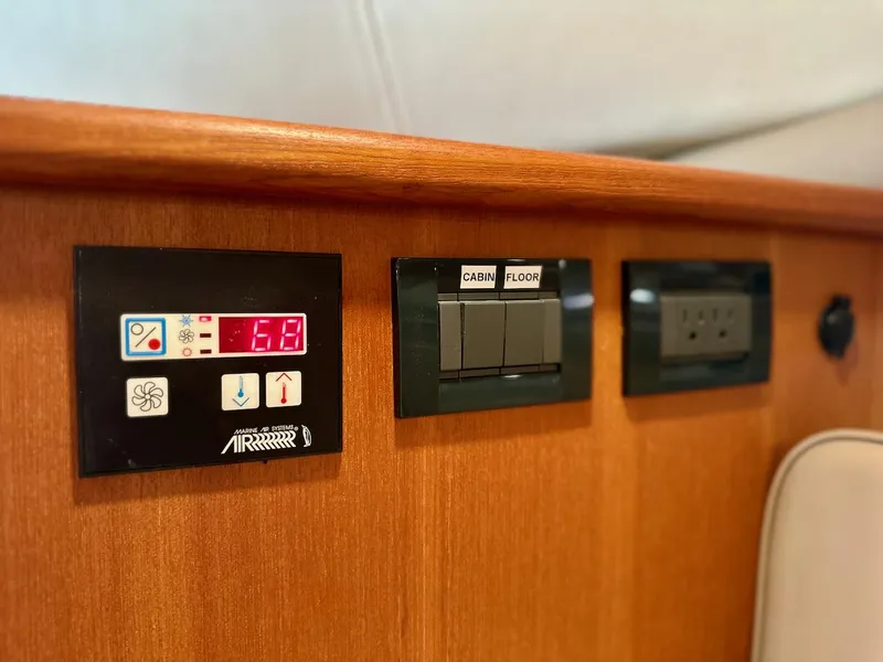 Slide: The Image of Control panel on 2009 Glacier Bay 3080 boat, featuring temperature and cabin controls. - 23