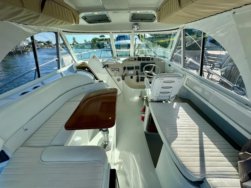 Slide: The Image of Interior of a 2009 Glacier Bay 3080 boat with seating and steering area. - 1