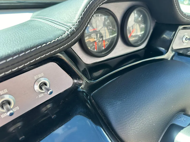 Slide: The Image of Dashboard of a 2021 MasterCraft NXT22 boat with gauges and switches. - 8