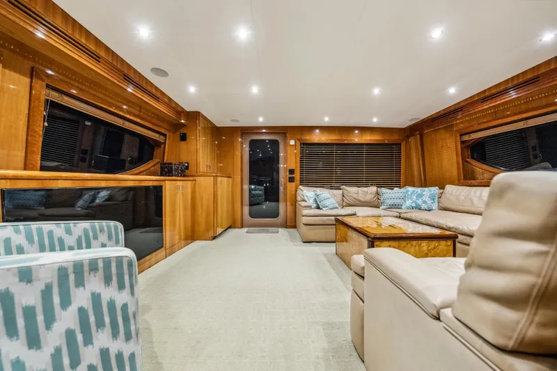 Slide: The Image of Luxurious interior of 2008 Hatteras 68 Convertible yacht with plush seating and elegant wood finishes. - 49