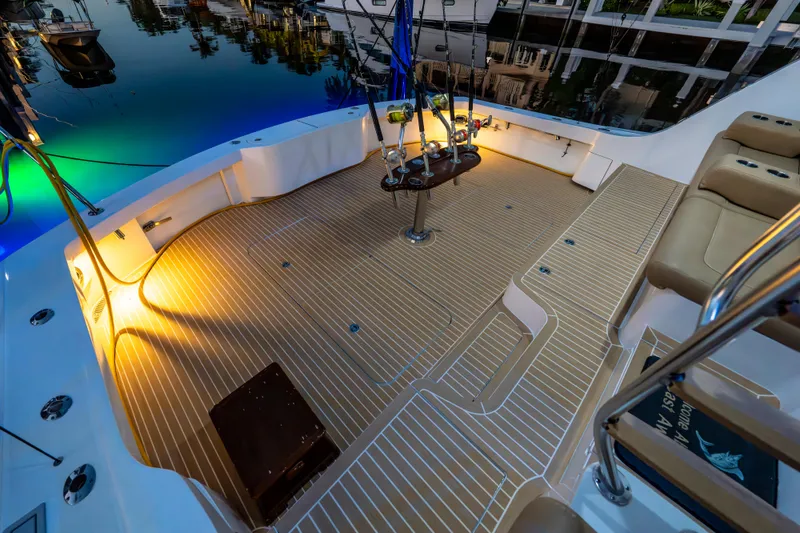 Slide: The Image of Luxurious deck of 2008 Hatteras 68 Convertible yacht, illuminated at dusk. - 24