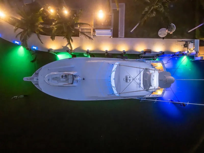 Slide: The Image of Aerial view of 2008 Hatteras 68 Convertible yacht docked with colorful lights. - 16