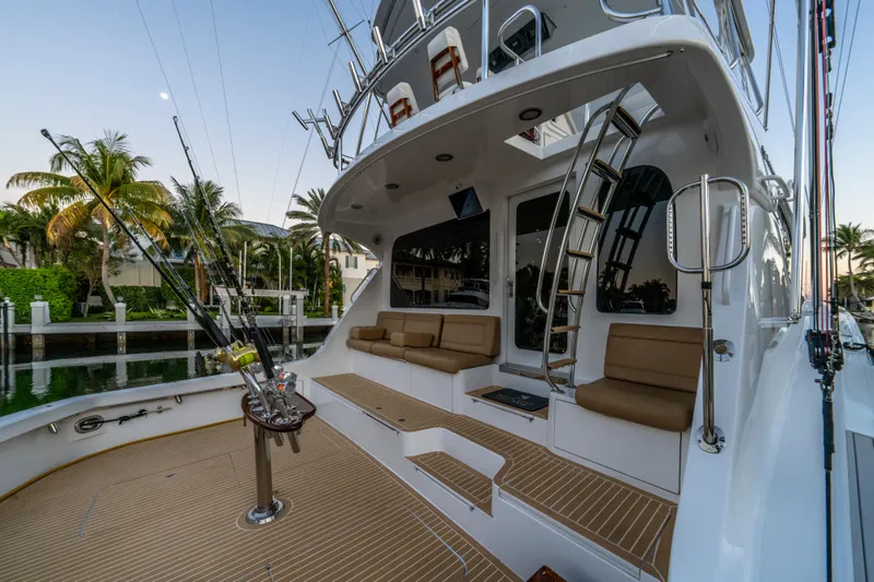 Slide: The Image of 2008 Hatteras 68 Convertible yacht with fishing gear and seating area. - 27