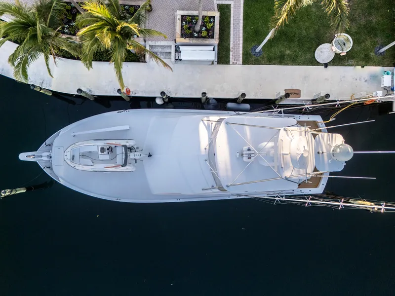 Slide: The Image of Aerial view of 2008 Hatteras 68 Convertible yacht docked by palm trees. - 7