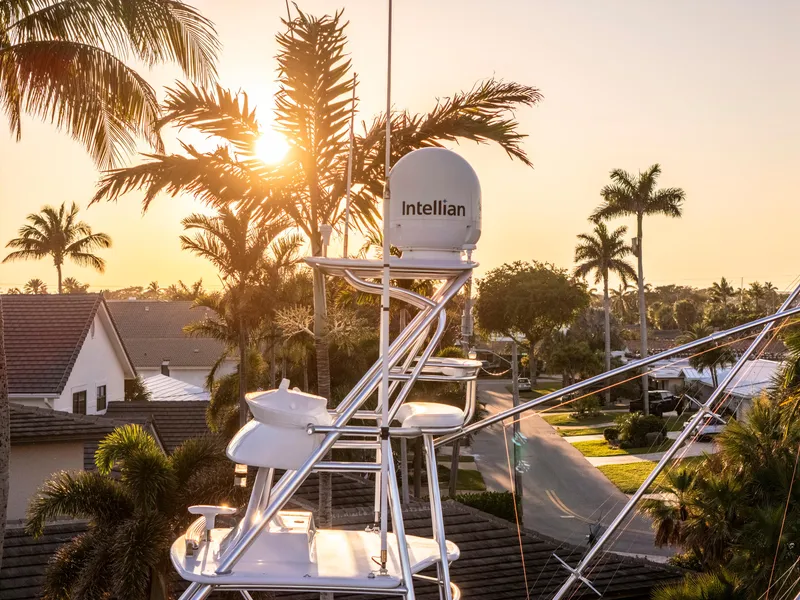 Slide: The Image of Sunset view from 2008 Hatteras 68 Convertible yacht with Intellian satellite dish. - 45