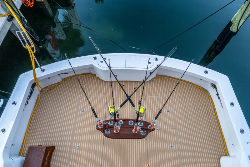 Slide: The Image of Fishing deck of 2008 Hatteras 68 Convertible yacht with rods and teak flooring. - 30