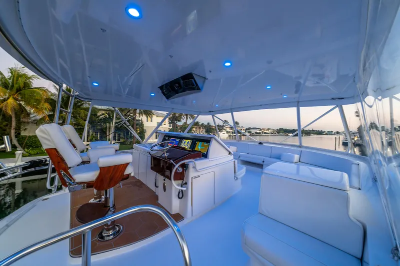 Slide: The Image of Luxurious 2008 Hatteras 68 Convertible yacht interior with modern helm and seating. - 34
