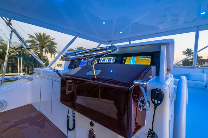 Slide: The Image of 2008 Hatteras 68 Convertible yacht helm with modern navigation equipment and luxurious design. - 32