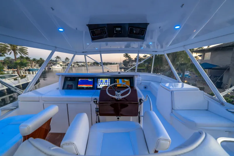 Slide: The Image of 2008 Hatteras 68 Convertible yacht cockpit with modern navigation system and luxurious seating. - 31