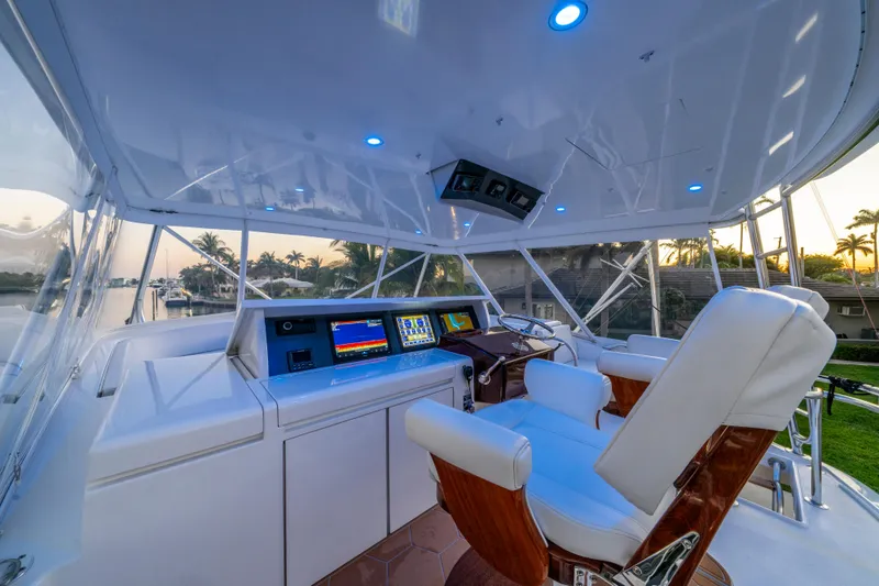 Slide: The Image of Helm of 2008 Hatteras 68 Convertible yacht with modern navigation equipment and luxurious seating. - 33