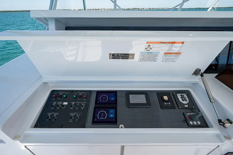 Slide: The Image of Control panel of a 2008 Hatteras 68 Convertible yacht with various instruments. - 37