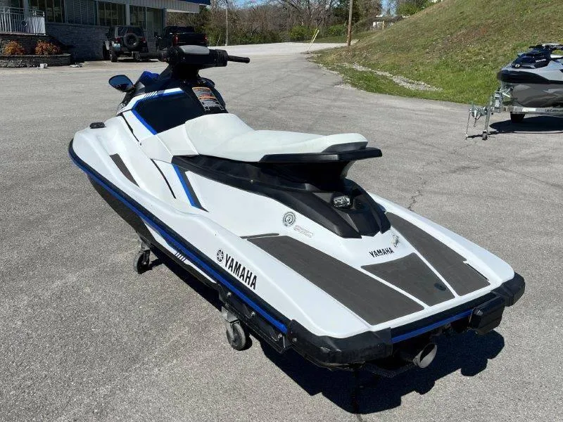 Slide: The Image of 2017 Yamaha WaveRunner EX Sport jet ski on pavement, white and black design. - 11
