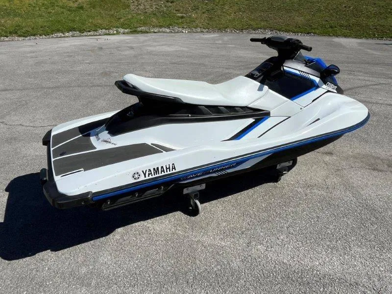 Slide: The Image of 2017 Yamaha WaveRunner EX Sport jet ski on pavement, side view. - 21