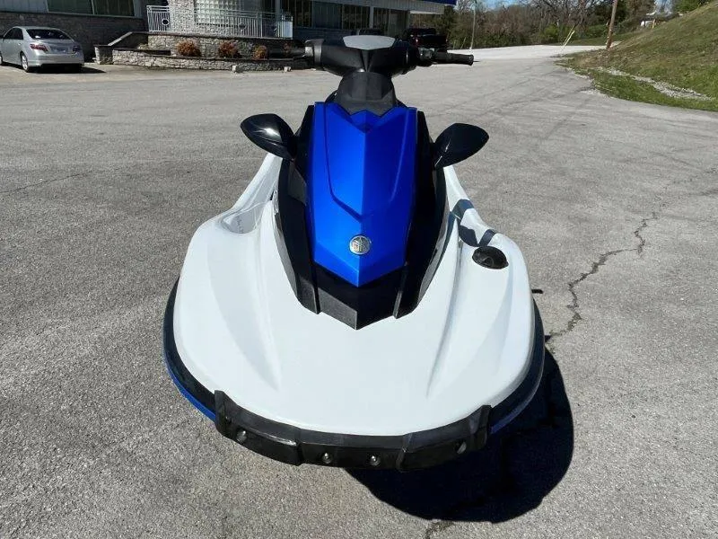 Slide: The Image of 2017 Yamaha WaveRunner EX Sport jet ski, blue and white, parked on pavement. - 26