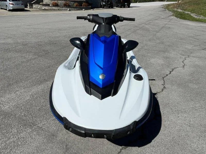 Slide: The Image of 2017 Yamaha WaveRunner EX Sport, blue and white jet ski on pavement. - 27