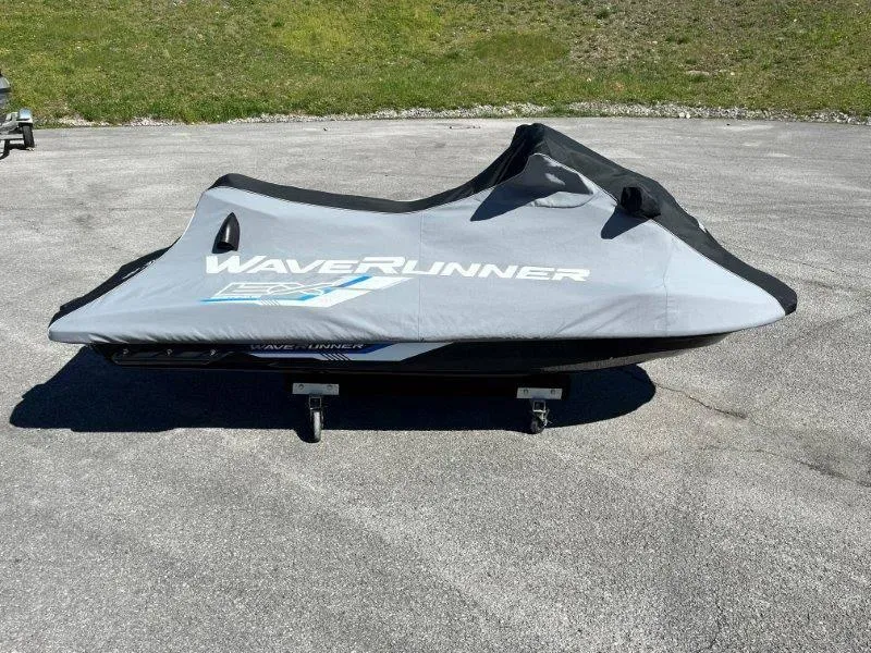 Slide: The Image of 2017 Yamaha WaveRunner EX Sport covered, parked on pavement. - 32