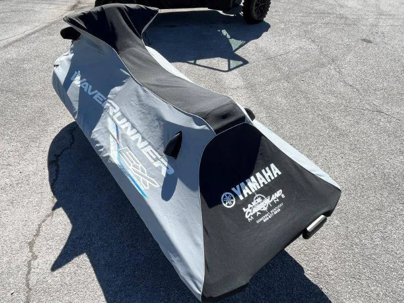 Slide: The Image of 2017 Yamaha WaveRunner EX Sport covered, parked on pavement, showcasing protective cover design. - 34