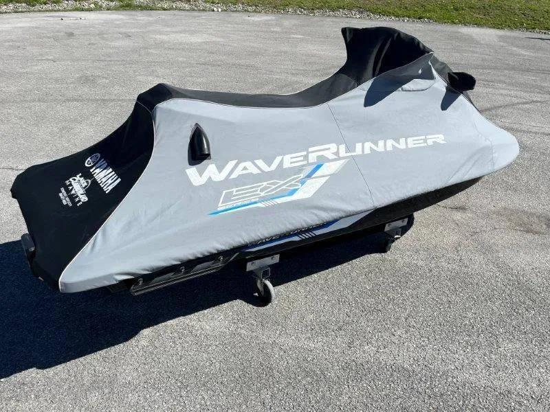 Slide: The Image of 2017 Yamaha WaveRunner EX Sport covered, parked on pavement. - 35