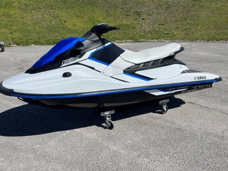 Slide: The Image of 2017 Yamaha WaveRunner EX Sport jet ski on pavement, featuring sleek blue and white design. - 9