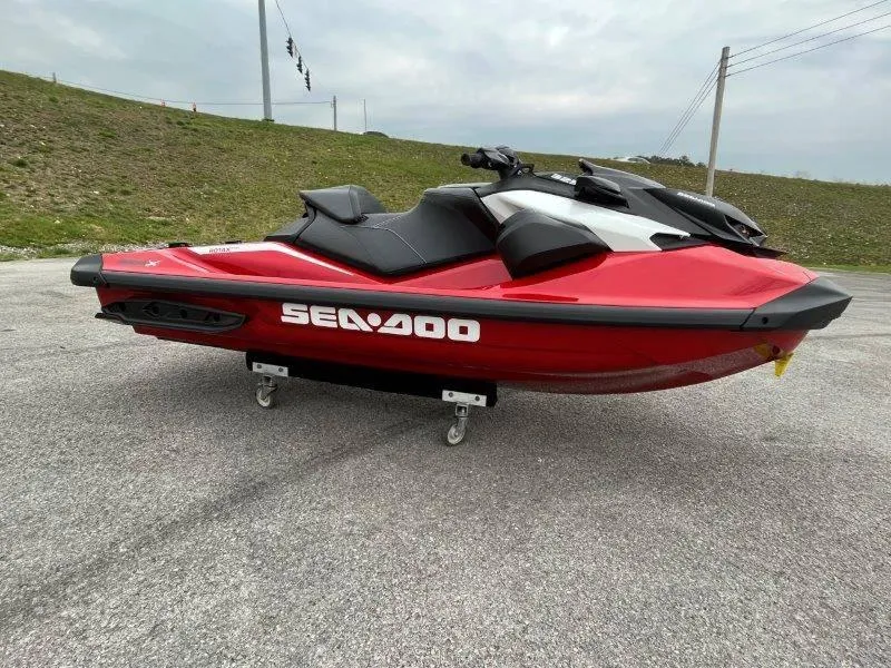 Slide: The Image of 2024 Sea-Doo RXP-X 325 Sound jet ski in vibrant red on display outdoors. - 1