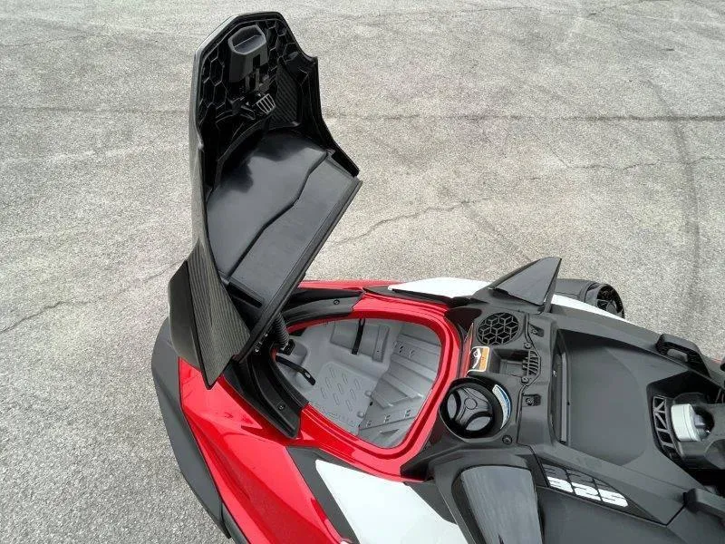 Slide: The Image of 2024 Sea-Doo RXP-X 325 Sound with open storage compartment, showcasing sleek design. - 17