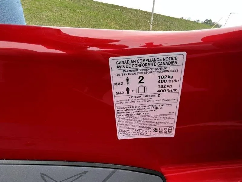 Slide: The Image of 2024 Sea-Doo RXP-X 325 Sound compliance notice, showing maximum capacity and weight limits. - 27