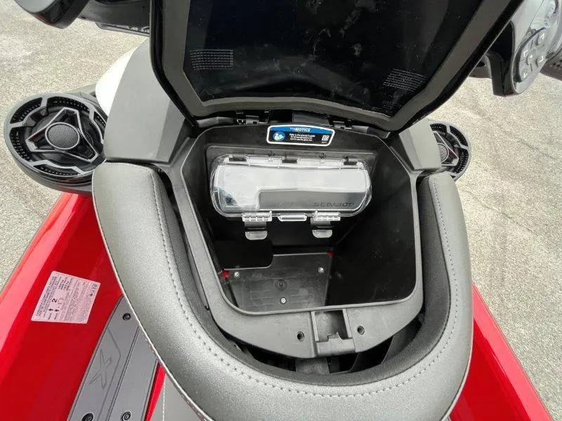 Slide: The Image of 2024 Sea-Doo RXP-X 325 Sound storage compartment, open view, showcasing interior design. - 34