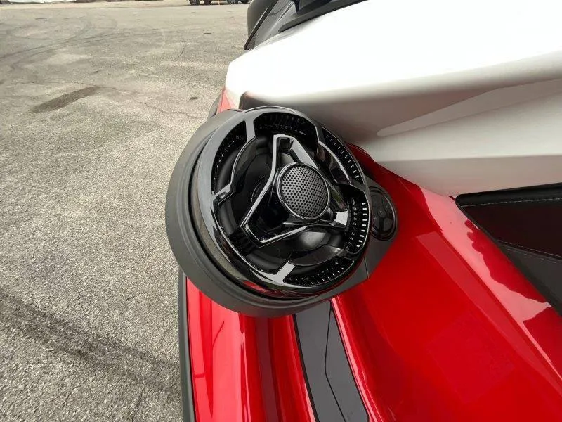 Slide: The Image of 2024 Sea-Doo RXP-X 325 Sound system detail, featuring sleek black speaker on red body. - 36