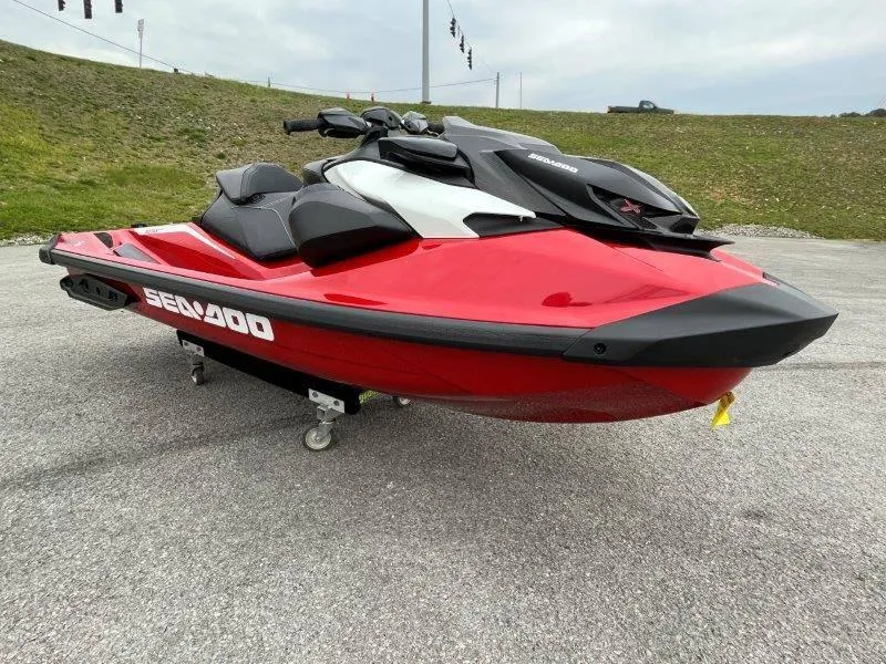 Slide: The Image of 2024 Sea-Doo RXP-X 325 Sound jet ski in vibrant red on display. - 8