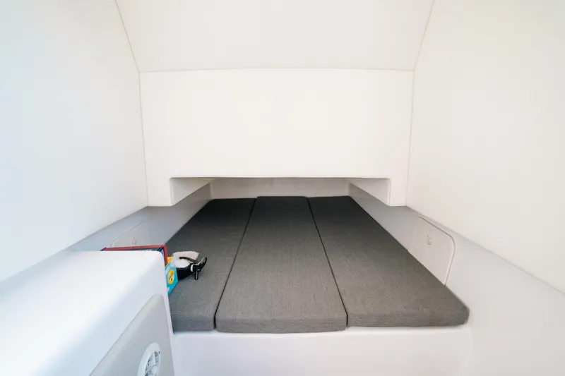 Slide: The Image of 2023 Front Runner 39 Center Console cabin interior with gray cushions. - 14