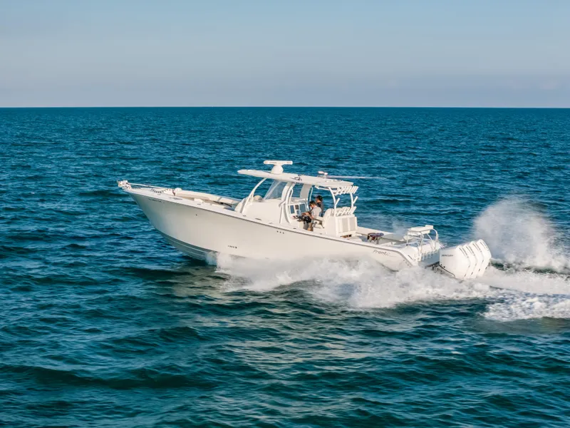 Slide: The Image of 2023 Front Runner 39 Center Console boat cruising on open water. - 27