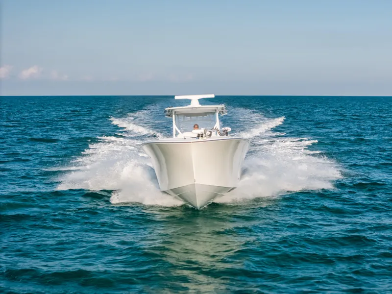 Slide: The Image of 2023 Front Runner 39 Center Console boat cruising on open ocean waters. - 29
