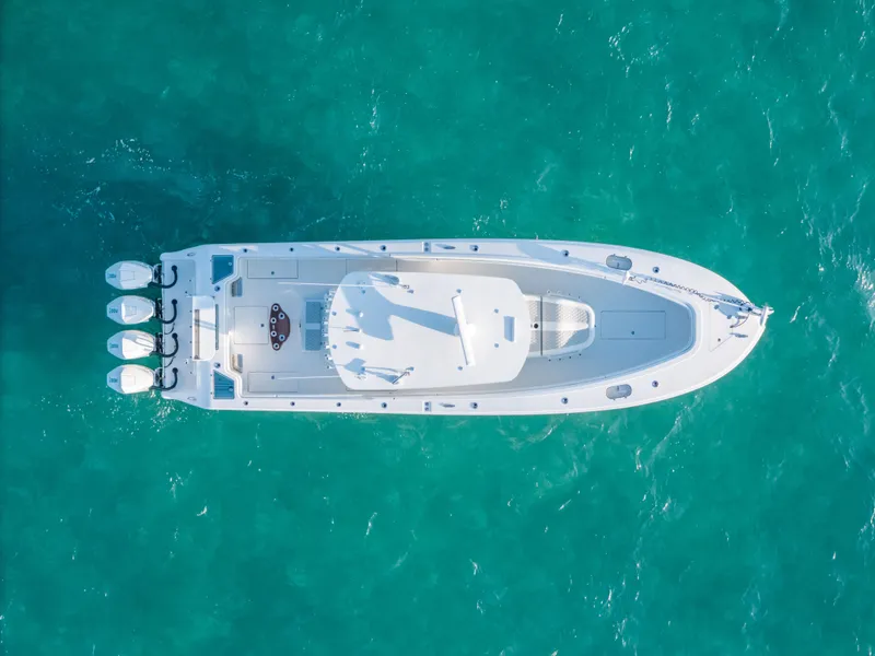 Slide: The Image of Aerial view of 2023 Front Runner 39 Center Console boat on turquoise water. - 31