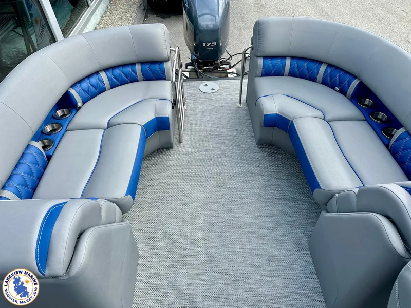 Slide: The Image of 2024 Bennington 23 LXFB pontoon boat with gray and blue seating, spacious deck layout. - 10