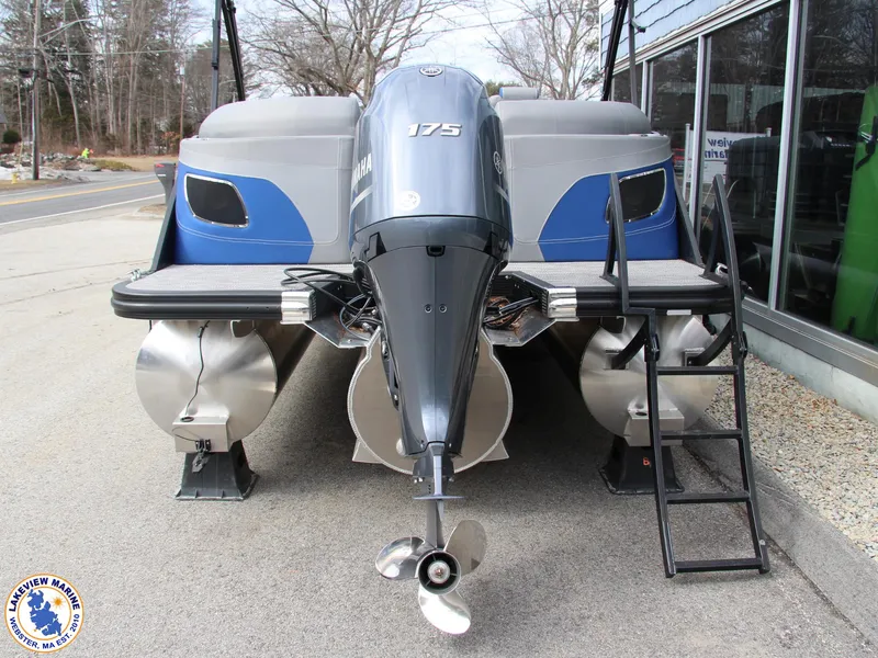 Slide: The Image of 2024 Bennington 23 LXFB pontoon boat with Yamaha 175 engine, docked outdoors. - 11